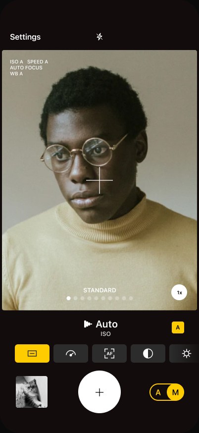Ordinary camera screen — a portrait in glasses, film look Standard